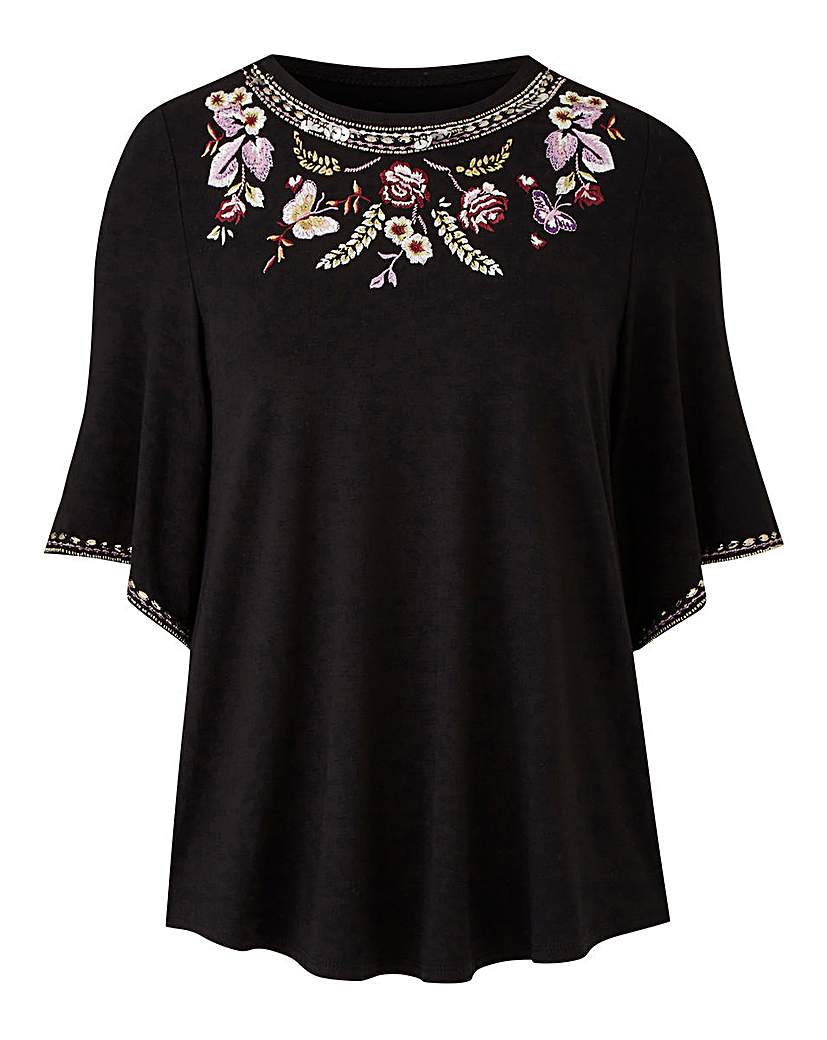 together embroidered top